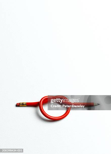 knot in red pencil - eraser on white stock pictures, royalty-free photos & images