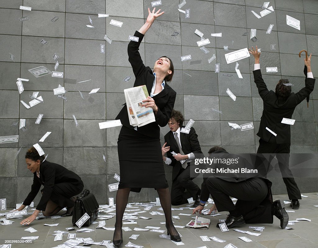 Catching Falling Business People On Pavement Catching Falling Money High-Res Stock Photo ...