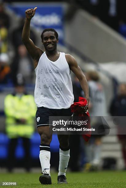 Jay-Jay Okocha of Bolton Wanderers celebrates his team retaining Premiership status after the FA Barclaycard Premiership match between Bolton...