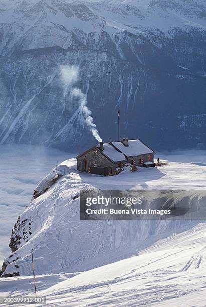 switzerland, valais, crans-montana, chalet on hilltop, winter - chalet de montagne photos et images de collection