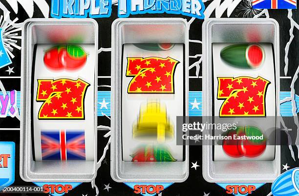 fruit machine bars spinning to line of 7's, close-up (blurred motion) - slot machine bildbanksfoton och bilder