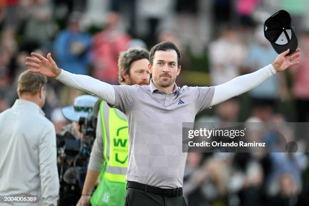 Nick Taylor of Canada celebrates making his putt to win on the second-playoff hole against Charley Hoffman of the United States during the final...