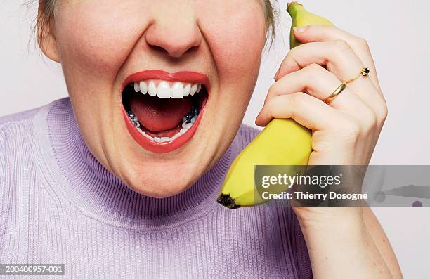 woman holding banana and screaming, close up - banana phone stock pictures, royalty-free photos & images