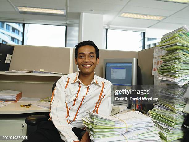 young man at desk, smiling, portrait - bundle stock pictures, royalty-free photos & images