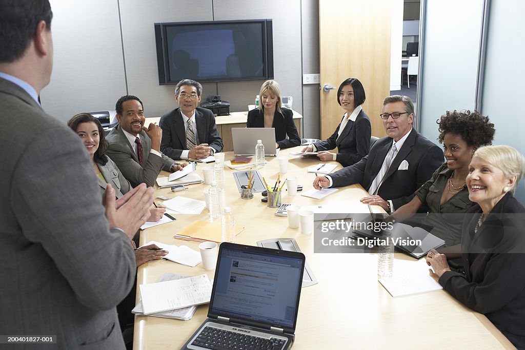 Businessman performing presentation to colleagues in meeting