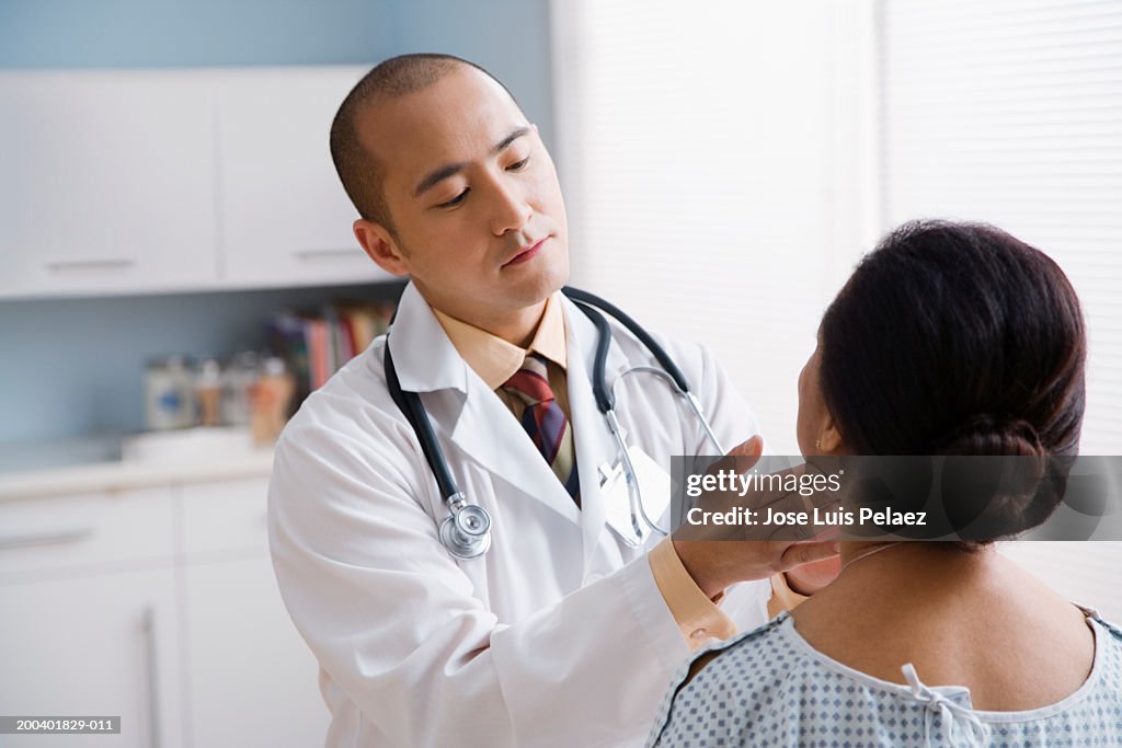 Doctor examining female patient