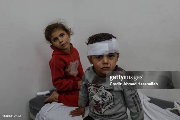 Injured Palestinian children receive treatment at Kuwait Hospital after Israeli air strikes on February 12, 2024 in Rafah, Gaza. Strikes intensified...