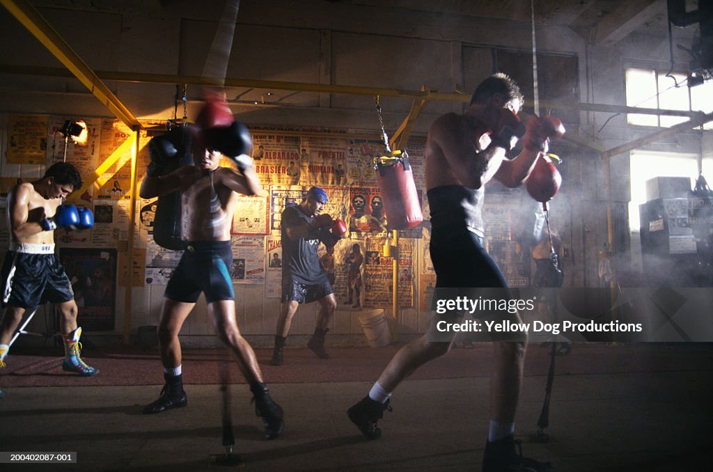 Male boxers working out in gym (blurred motion)