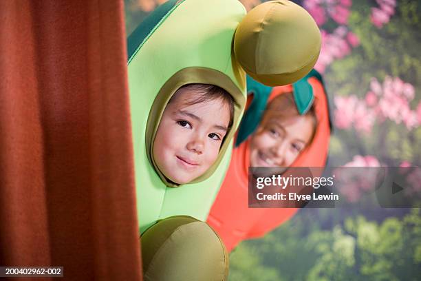 two children (5-9) in school play, looking out from behind curtain - school play 個照片及圖片檔