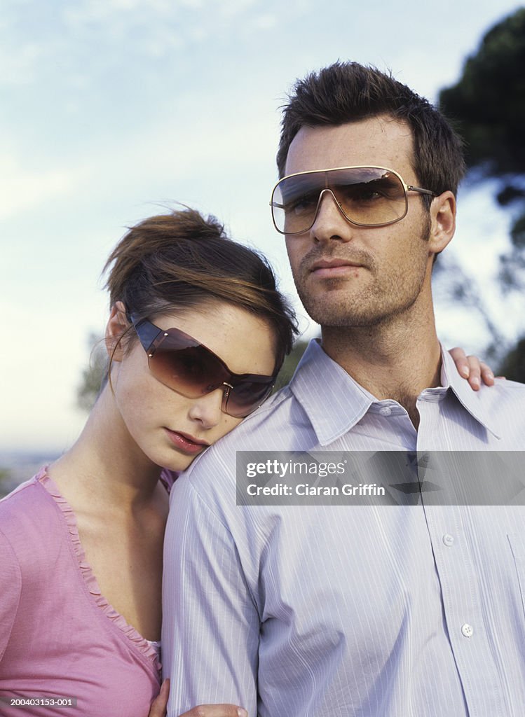 Young couple wearing sunglasses