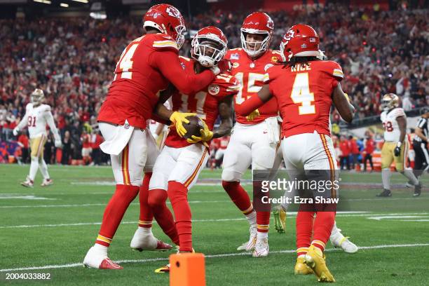 Marquez Valdes-Scantling of the Kansas City Chiefs celebrates with teammates after catching a pass for a touchdown in the third quarter against the...