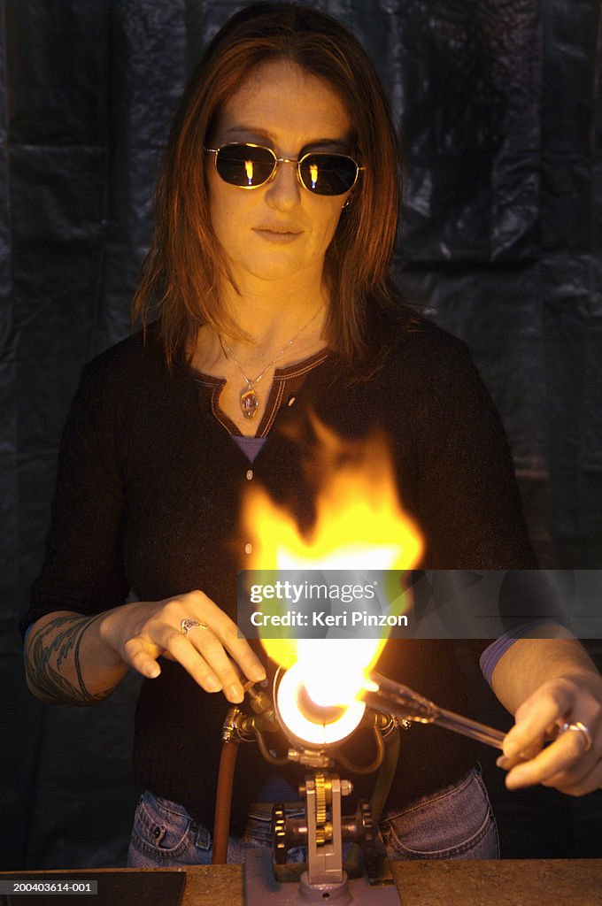 Woman Using Torch On Glass For Glass Blowing High-Res Stock Photo - Getty  Images