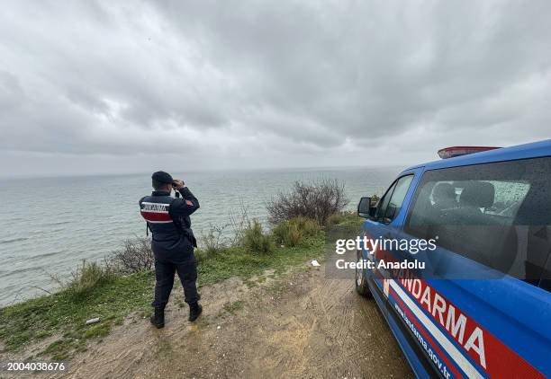 Turkish Gendarmerie General Command members follow the rescue efforts for the crew of the 69-meter-long BATUHAN A, which took on water and sank in...