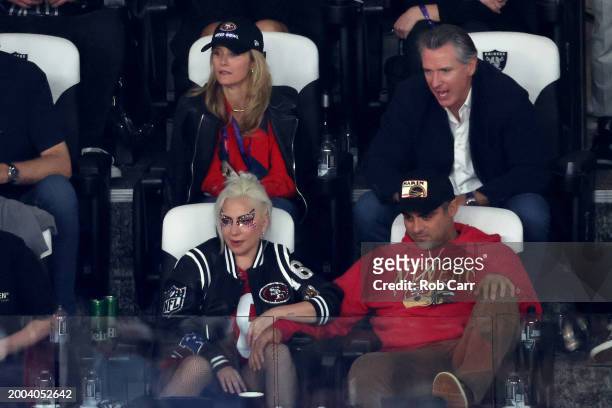 Jennifer Siebel Newsom and California Governor Gavin Newsom and Lady Gaga with boyfriend Michael Polansky look on in the third quarter during Super...