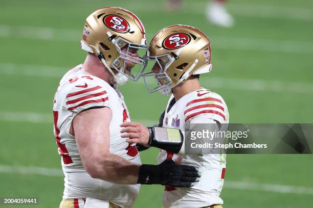 Brock Purdy of the San Francisco 49ers celebrates with Jake Brendel after throwing a pass for a touchdown in the fourth quarter against the Kansas...