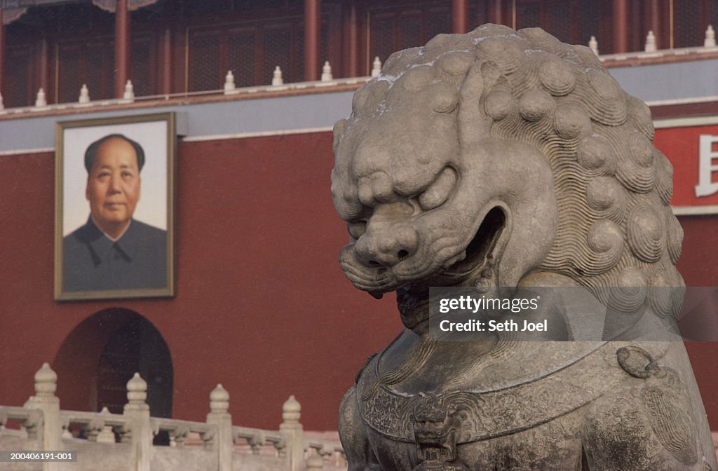 China, Beijing, The Forbidden City, guardian statue in foreground