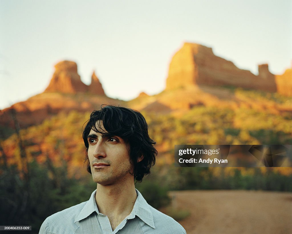 Man standing on desert road, close-up