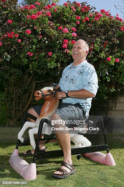 Man Riding Rocking Horse Man Rocking Horse Photos and Premium High Res Pictures - Getty Images