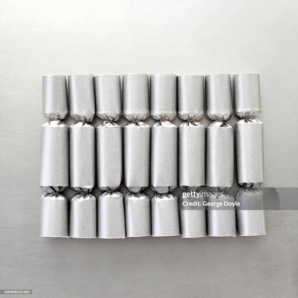 Eight silver christmas crackers in row