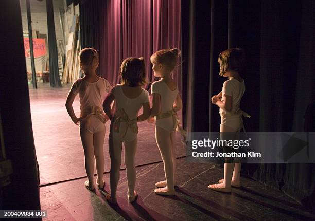 female ballet students (4-6) watching from backstage, rear view - back stage stock pictures, royalty-free photos & images