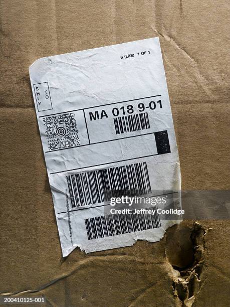 shipping label on torn box, close-up - bar code stock pictures, royalty-free photos & images