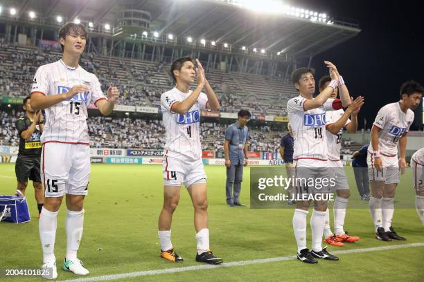 Sagan Tosu players applaud fans after the team's 3-0 victory in the J.League J1 match between Sagan Tosu and Omiya Ardija at Best Amenity Stadium on...