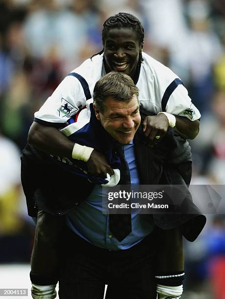 Bernard Mendy of Bolton Wanderers celebrates survival in the Premier League with manager Sam Allardyce after the FA Barclaycard Premiership match...
