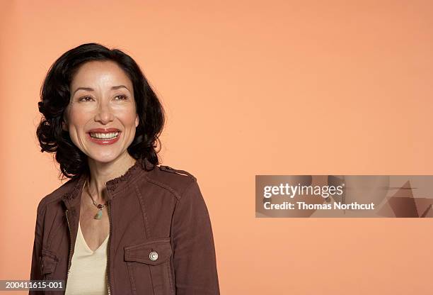 mature woman smiling, looking up - society beauty stock-fotos und bilder