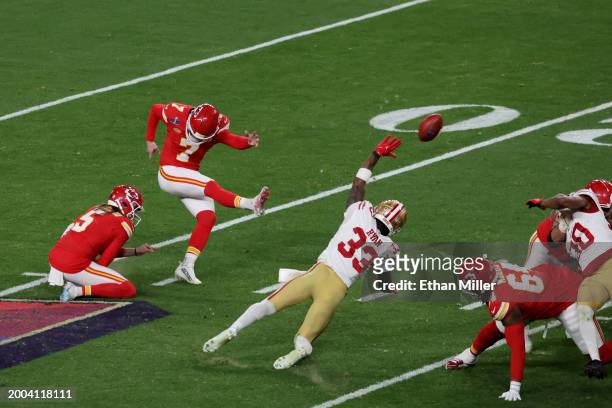 Harrison Butker of the Kansas City Chiefs kicks a 29-yard field goal late in the fourth quarter to tie the game against the San Francisco 49ers...