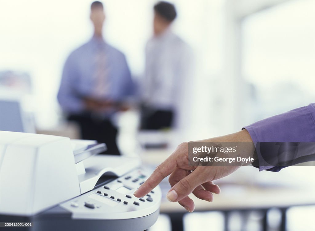 Man using photocopier, close up