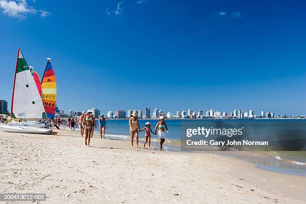 uruguay, punta del este, people walking on beach - punta del este fotografías e imágenes de stock