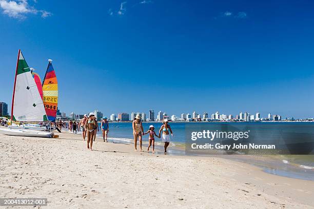 uruguay, punta del este, people walking on beach - punta del este photos et images de collection