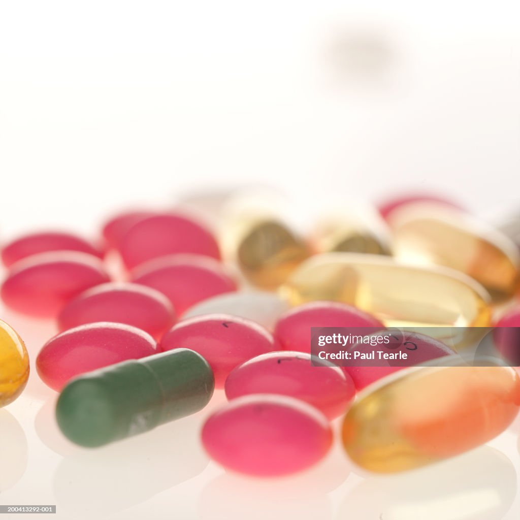 Assorted coloured pills, close up