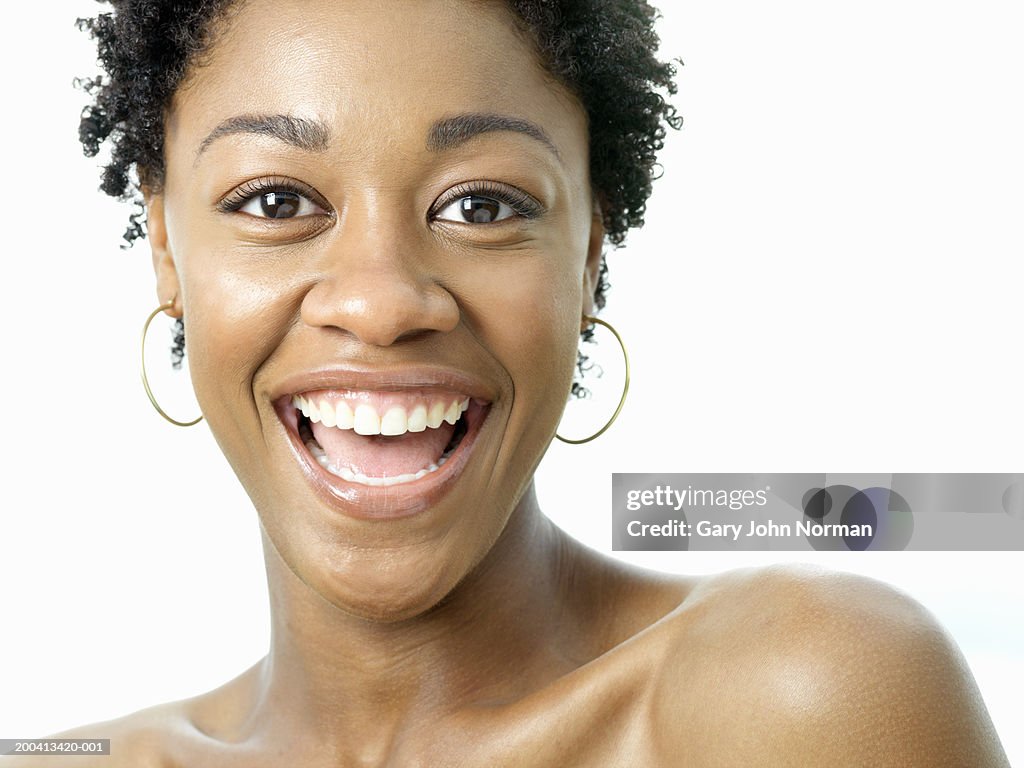 Young woman smiling, portrait, close-up