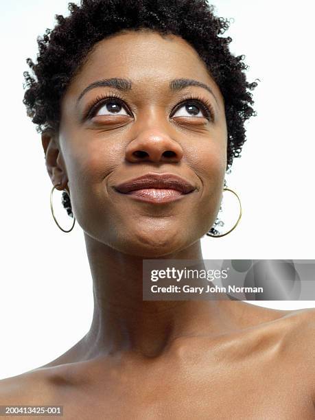 young woman looking up, close-up - earrings stock pictures, royalty-free photos & images