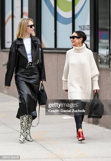 Lisa Aiken seen wearing a black biker jacket, white shirt, black skirt and snakeskin boots and Tracy Taylor seen wearing a cream sweater, black...