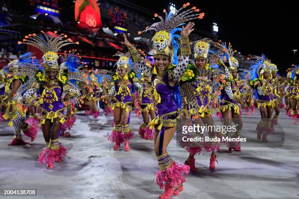 Members of Beija Flor perform during 2024 Carnival parades at Sapucai Sambodrome on February 11, 2024 in Rio de Janeiro, Brazil.