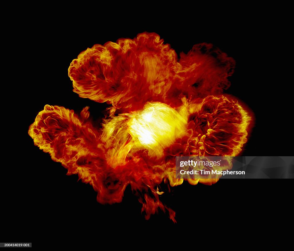 Explosive flame against black background (Digital Composite)