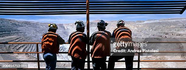 chile, atacama region, four men at chuquicamata copper refinery - mining worker stock pictures, royalty-free photos & images