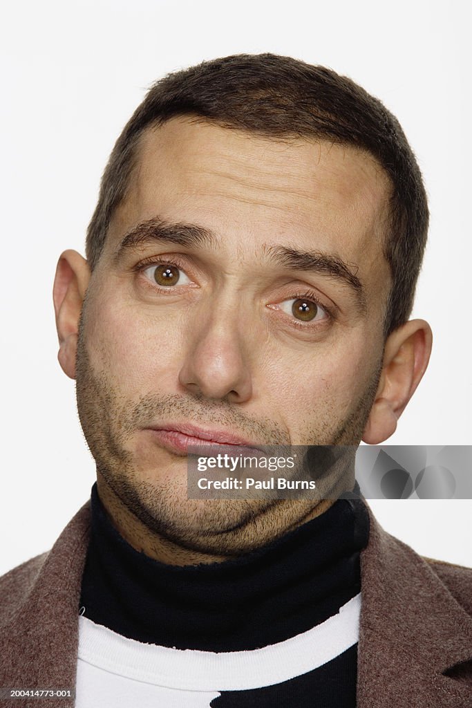 Young man making face, portrait, close-up