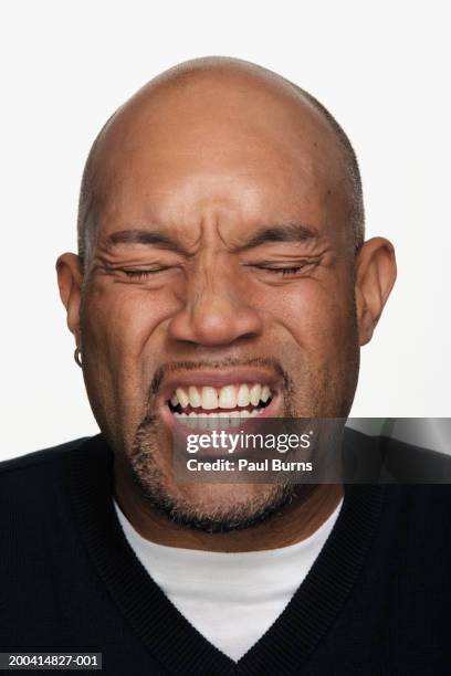 man making face, close-up - grimacing stock pictures, royalty-free photos & images