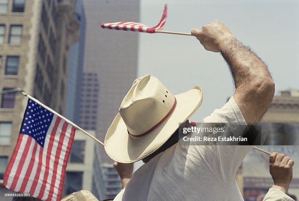 Man waving US flag during Immigration Bill Rally in Los Angeles