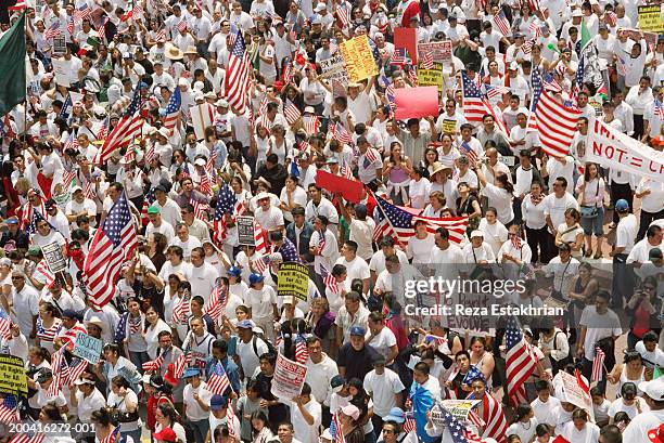 large crowds marching during immigration bill rally in los angeles - day without immigrants protest in united states photos et images de collection