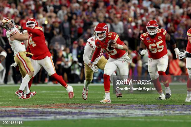 Patrick Mahomes of the Kansas City Chiefs runs the ball in overtime against the San Francisco 49ers during Super Bowl LVIII at Allegiant Stadium on...