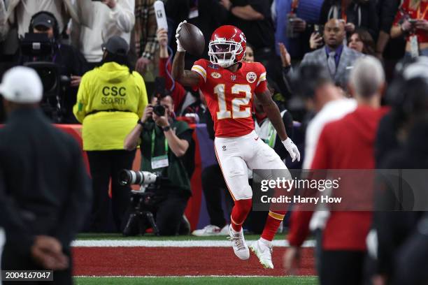 Mecole Hardman Jr. #12 of the Kansas City Chiefs catches a pass for a touchdown to defeat the San Francisco 49ers 25-22 in overtime during Super Bowl...