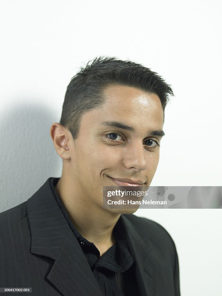 Young man smiling, portrait, close-up