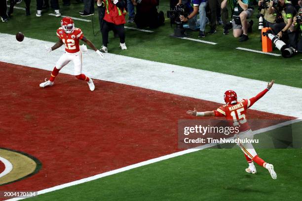 Mecole Hardman Jr. #12 of the Kansas City Chiefs celebrates with Patrick Mahomes after scoring the game-winning touchdown in overtime to defeat the...