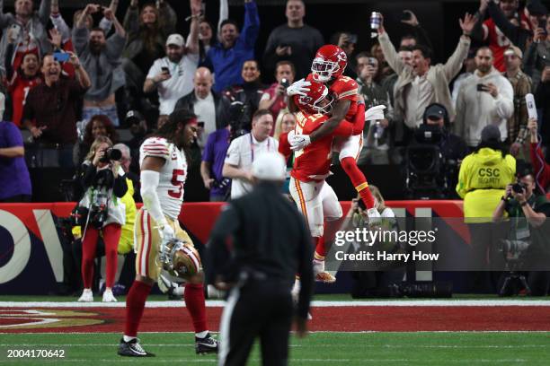 Mecole Hardman Jr. #12 of the Kansas City Chiefs celebrates with Patrick Mahomes after scoring the game-winning touchdown in overtime to defeat the...