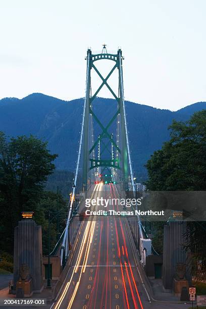 canada, british columbia, vancouver, traffic on lions gate bridge - vancouver lions gate stock pictures, royalty-free photos & images