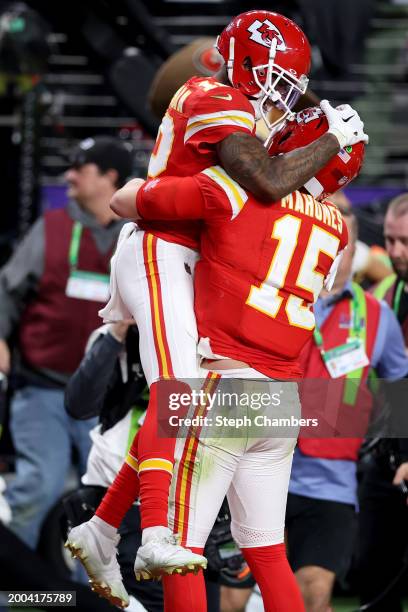 Mecole Hardman Jr. #12 of the Kansas City Chiefs celebrates with Patrick Mahomes after scoring the game-winning touchdown in overtime to defeat the...